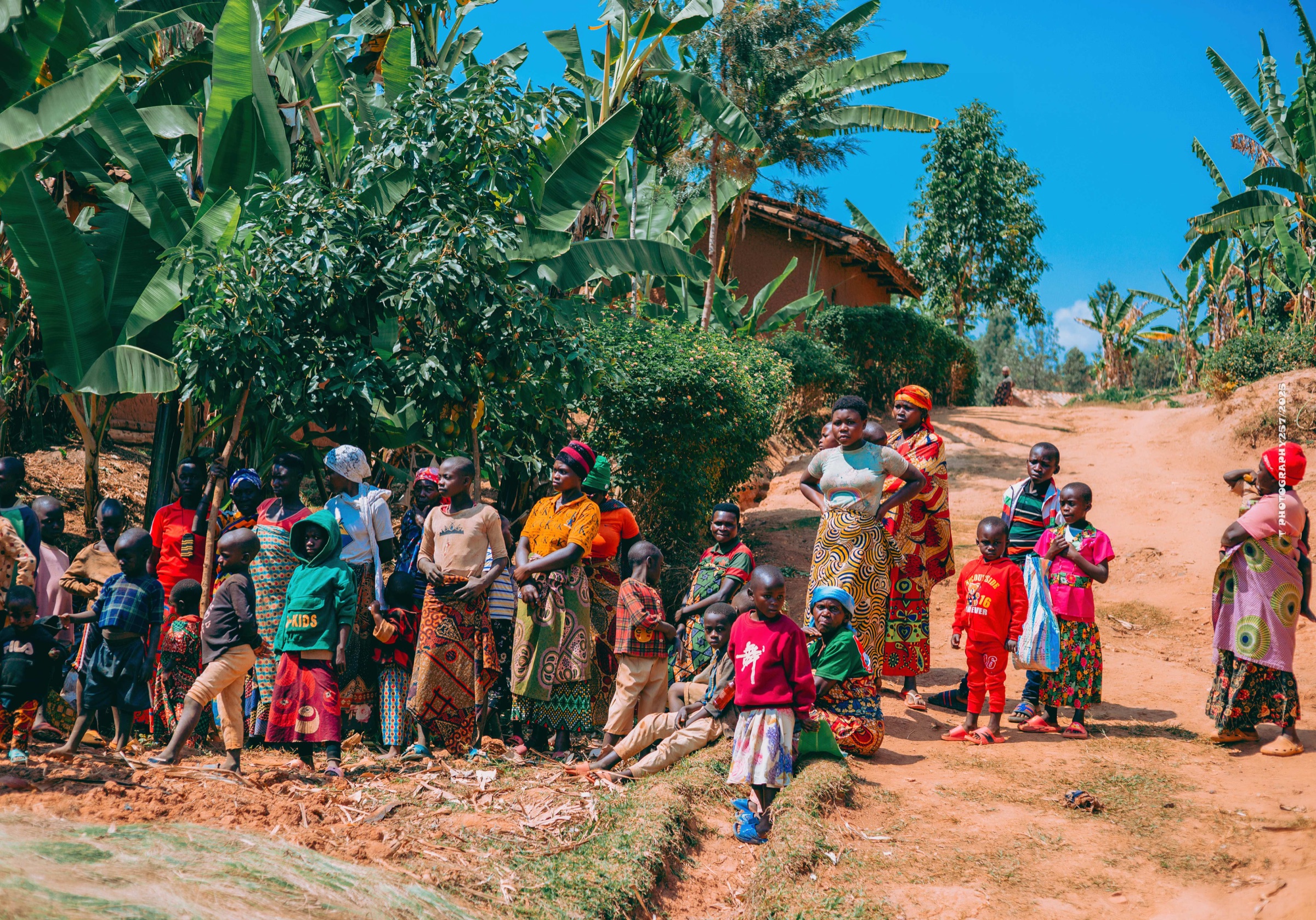 Community members gather along a road in Burundi