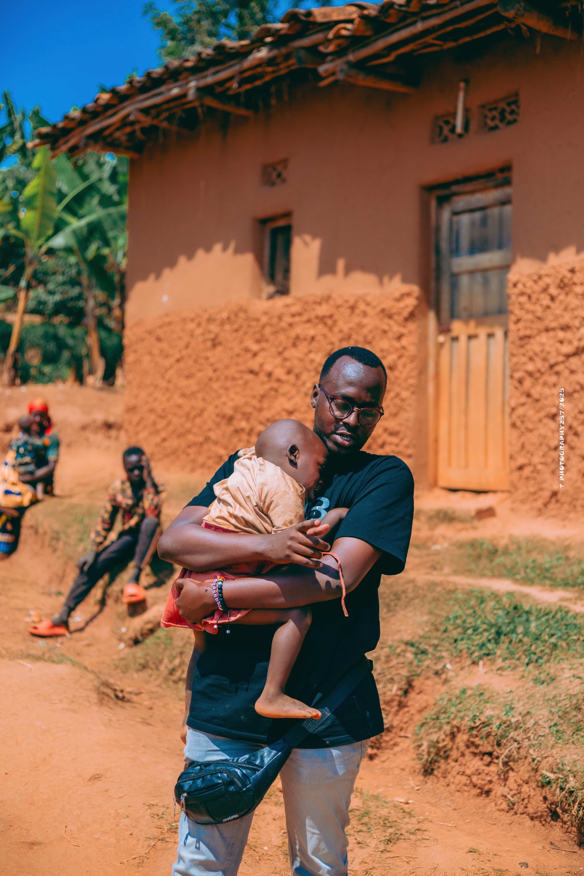 Pastor Jean Congera holding a child in Burundi